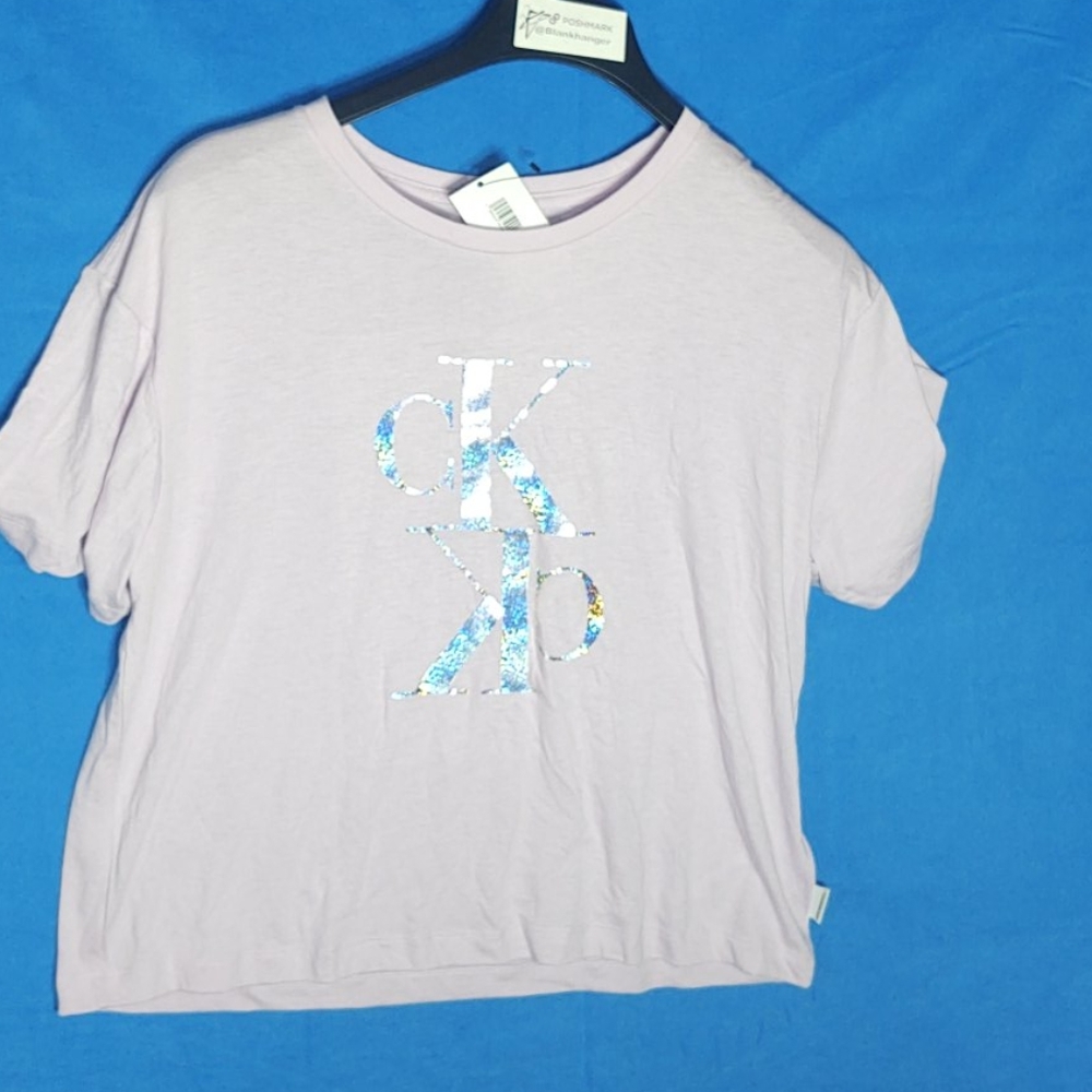 Calvin Klein Jeans pink short sleeve top with a reflective silver CK logo